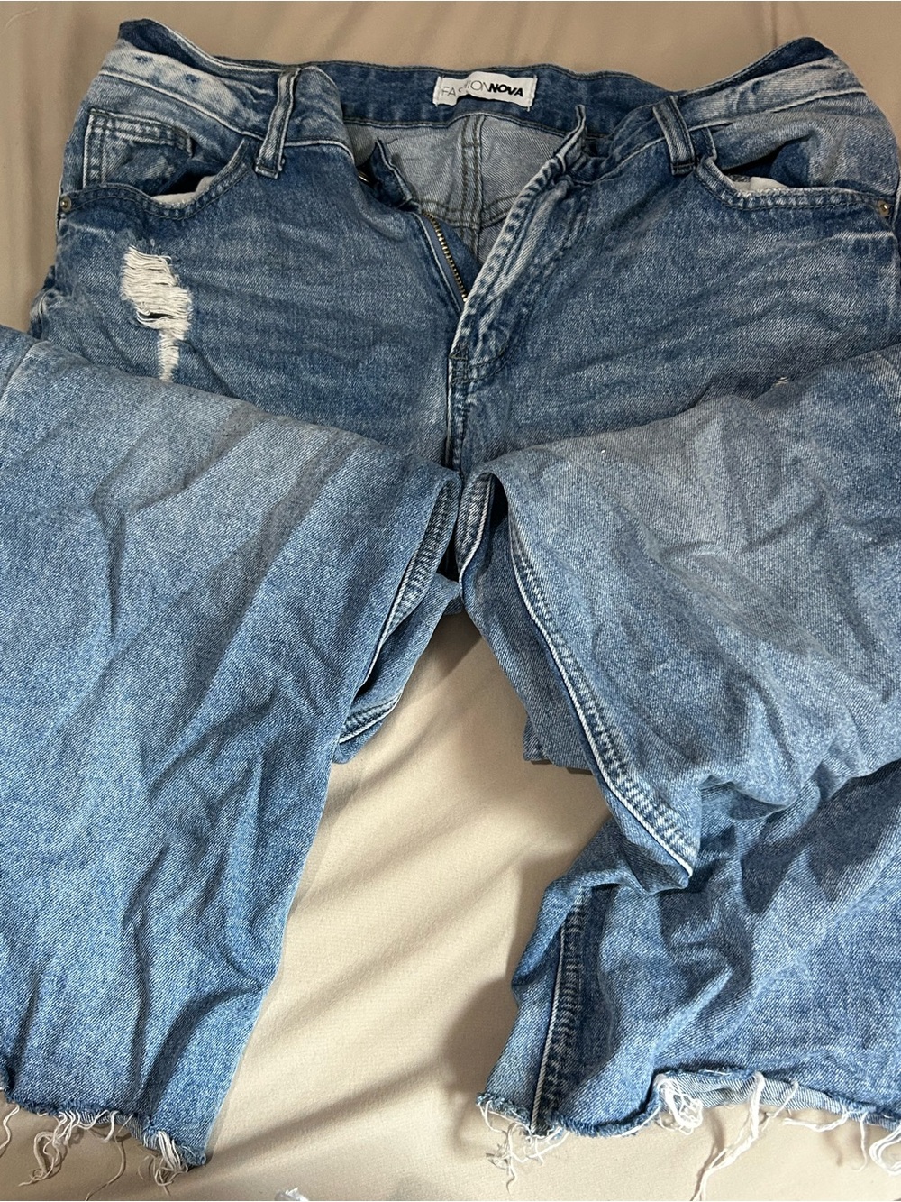 Fashion Nova Women’s Light Blue Flared Distressed Jeans